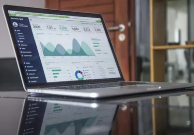 Marketing data and charts displayed on a laptop